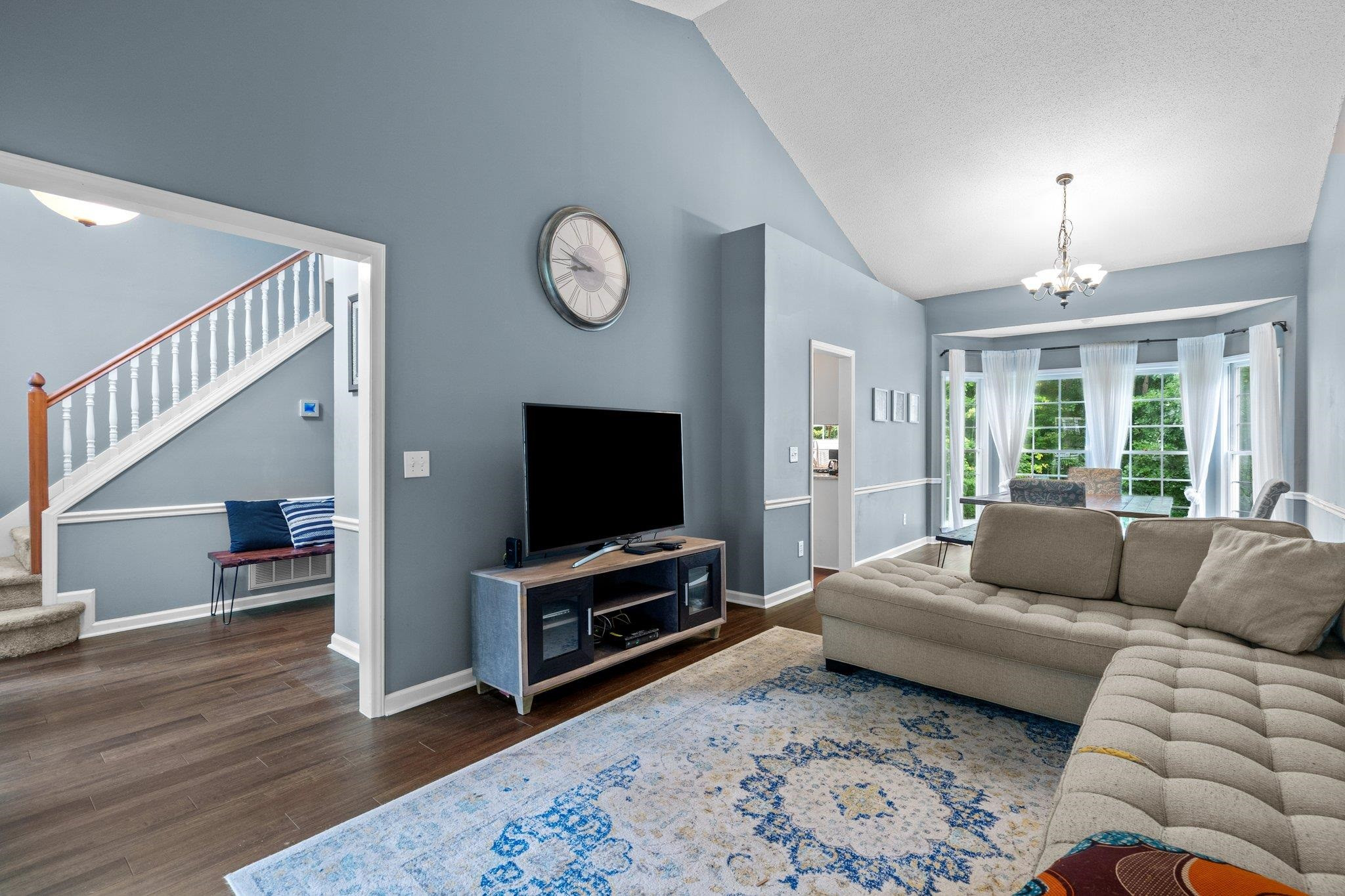 6305 Dry Fork Lane Raleigh, NC 27617 - Photo 10 of 41 a living room with furniture and a flat screen tv