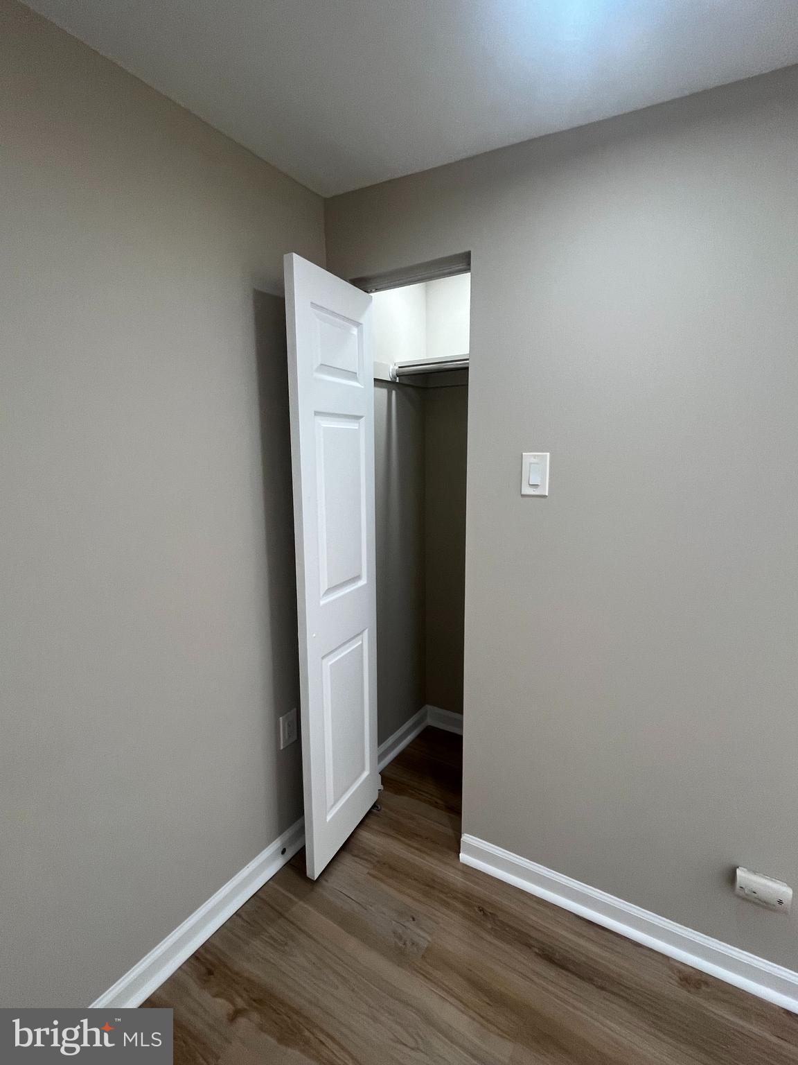 1881 Williamstown Road Sicklerville, NJ 08081 - Photo 4 of 13 an empty room with wooden floor and closet
