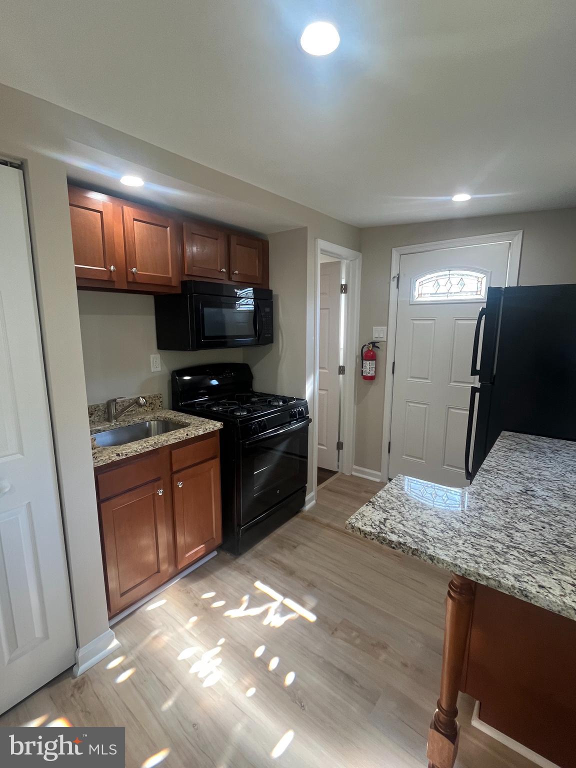 1881 Williamstown Road Sicklerville, NJ 08081 - Photo 6 of 13 a kitchen with a sink and a refrigerator