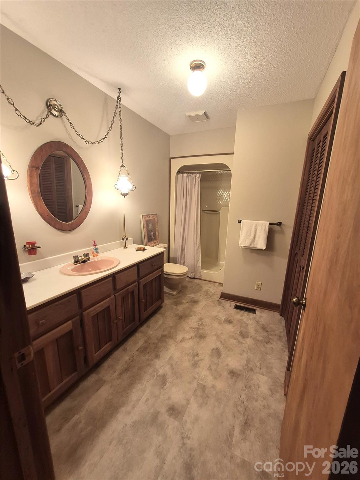 1368 Cajah Mountain Road Hudson, NC 28638 - Photo 21 of 46 a spacious bathroom with a sink double vanity and a mirror