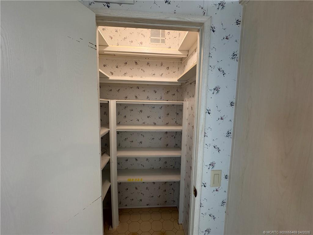 4236 Southeast Sweetwood Way Stuart, FL 34997 - Photo 12 of 50 a view of an empty walk in closet