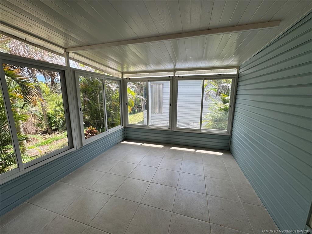 4236 Southeast Sweetwood Way Stuart, FL 34997 - Photo 28 of 50 a view of an empty room with a window