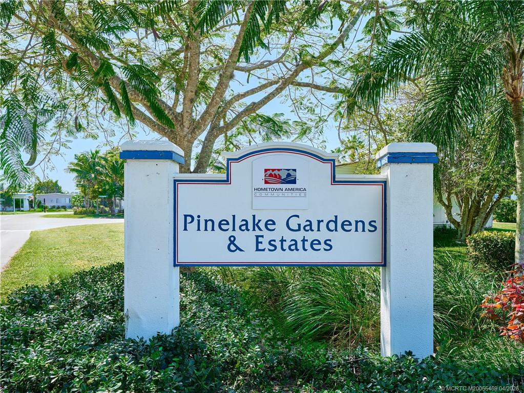 4236 Southeast Sweetwood Way Stuart, FL 34997 - Photo 37 of 50 a sign broad in front of red brick house