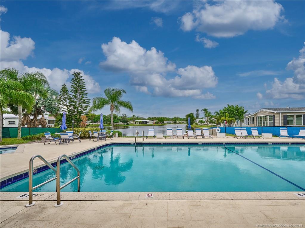 4236 Southeast Sweetwood Way Stuart, FL 34997 - Photo 45 of 50 a view of swimming pool from a lake view