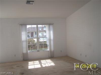 8405 Matanzas Road Fort Myers, FL 33967 - Photo 2 of 5 an empty room with windows
