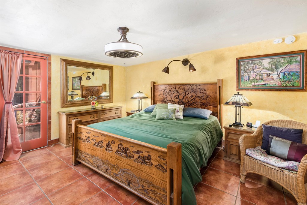 1168 Alpine Heights Road Alpine, CA 91901 - Photo 11 of 72 a bed room with a bed and a chandelier