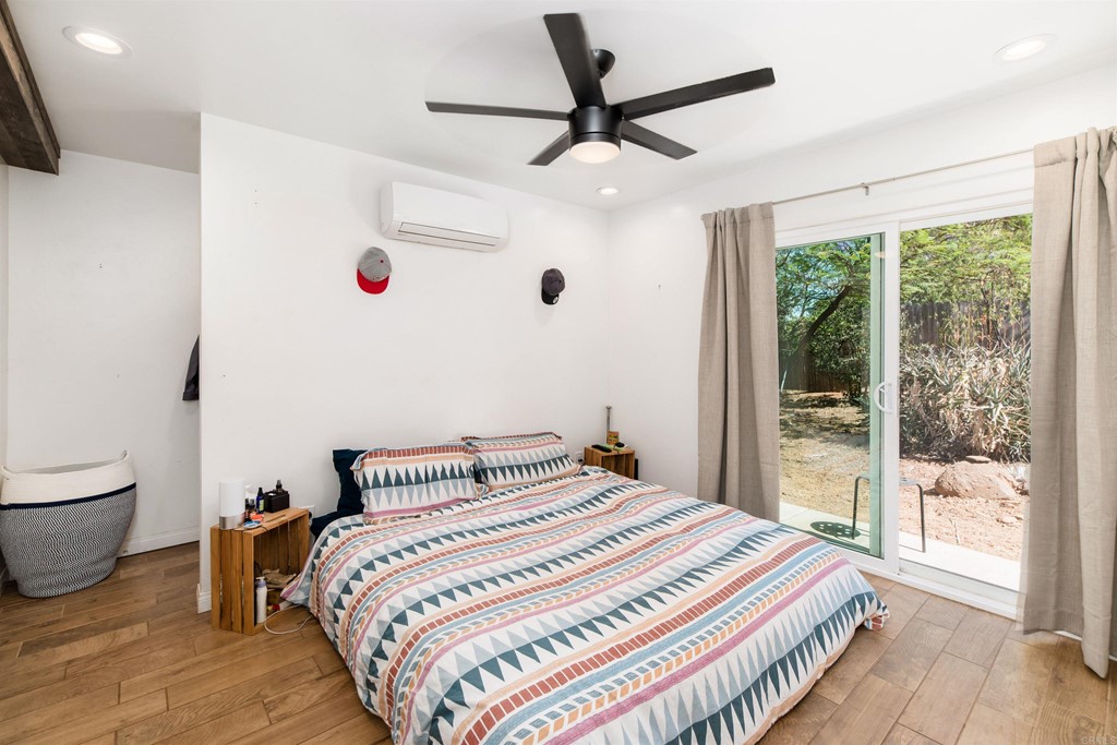 1168 Alpine Heights Road Alpine, CA 91901 - Photo 25 of 72 a bedroom with a large bed and a large window