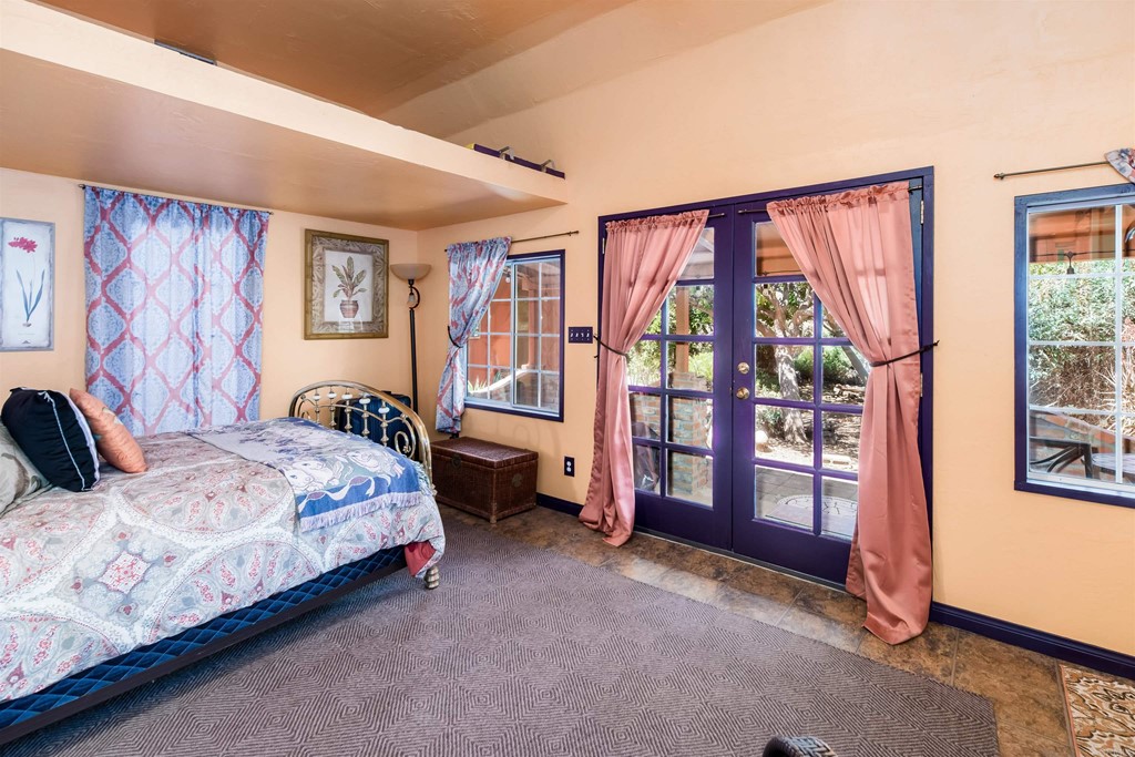 1168 Alpine Heights Road Alpine, CA 91901 - Photo 31 of 72 a bedroom with a bed and a large window