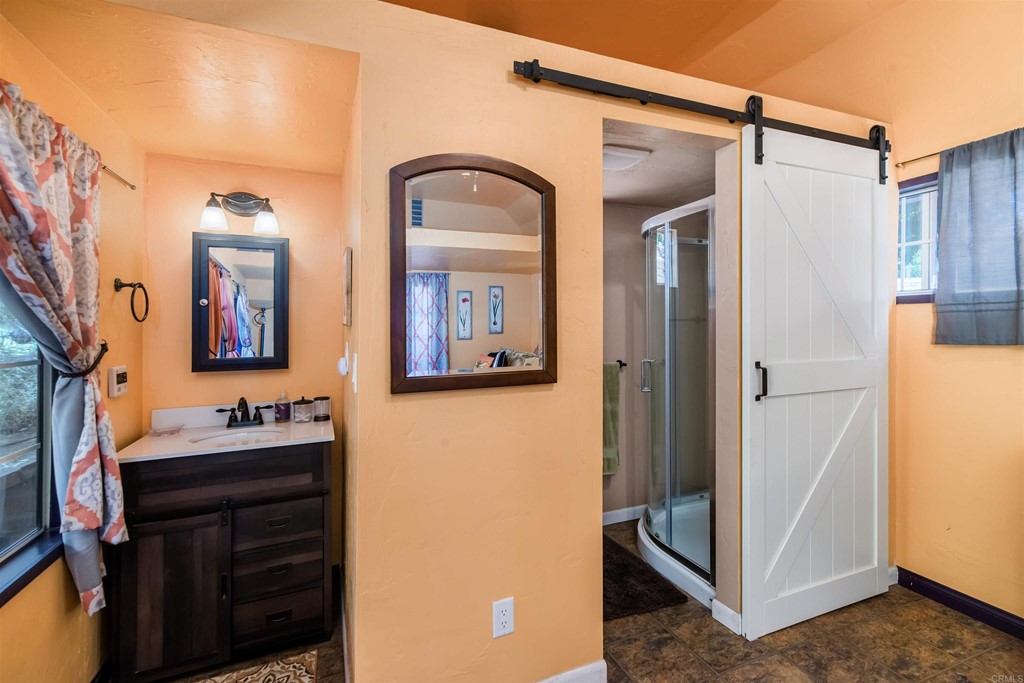 1168 Alpine Heights Road Alpine, CA 91901 - Photo 32 of 72 a bathroom with a sink and a mirror