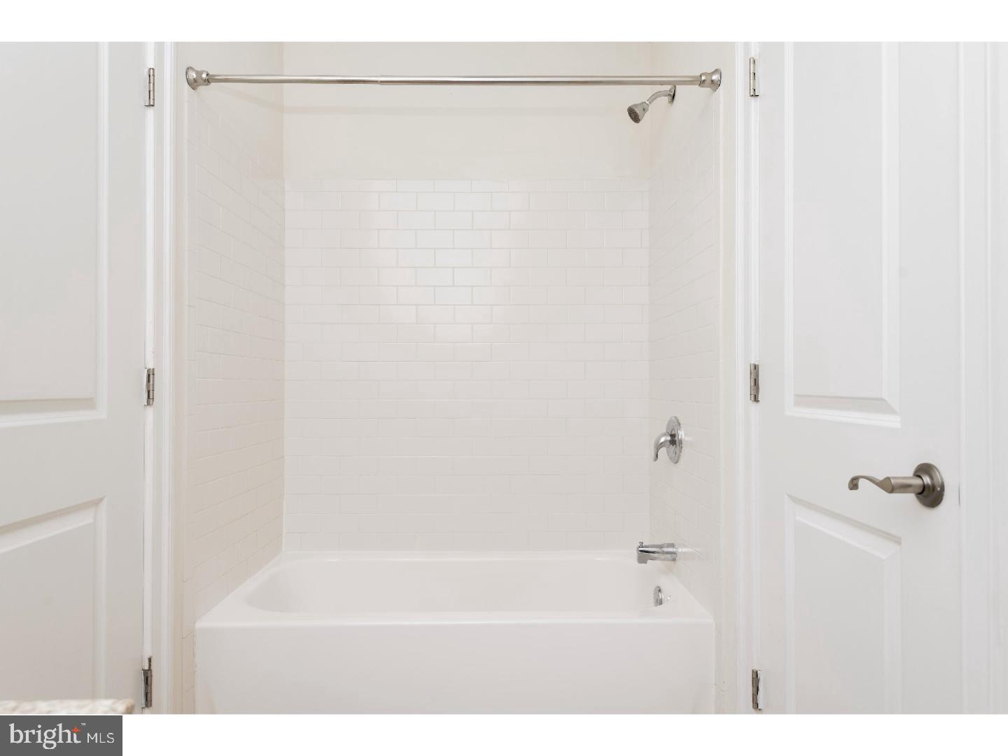 1900-20 Arch Street, Unit 514 Philadelphia, PA 19103 - Photo 16 of 30 a bathroom with a shower and a bath tub