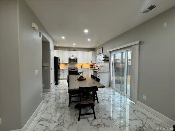 a dining room with furniture
