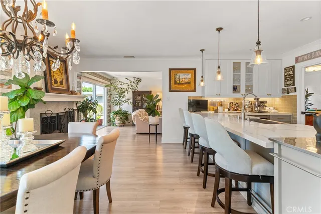 a large kitchen with a table and chairs