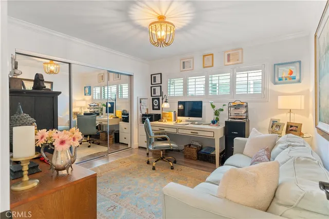 a view of a livingroom with workspace and a couch