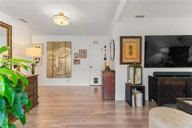 a view of a livingroom with furniture and a flat screen tv