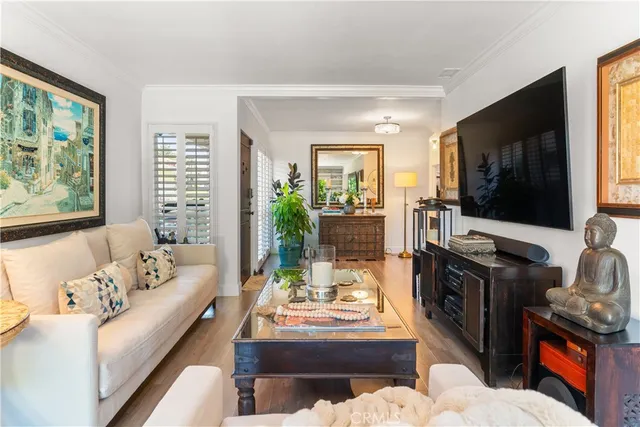 a living room with fireplace furniture and a flat screen tv