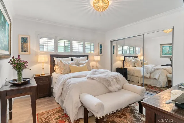 a bedroom with bed and a window