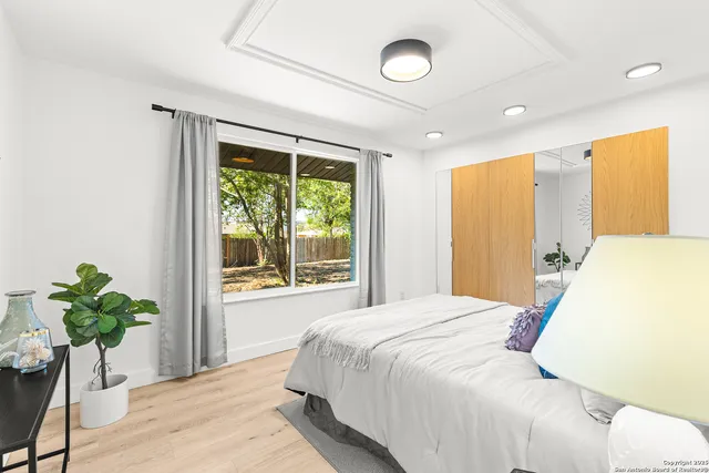 a work room with furniture and a window