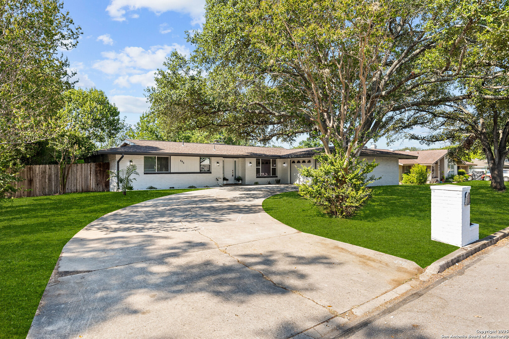 446 Spaceway Drive Windcrest, TX 78239 - Photo 2 of 28 a front view of a house with a yard and trees