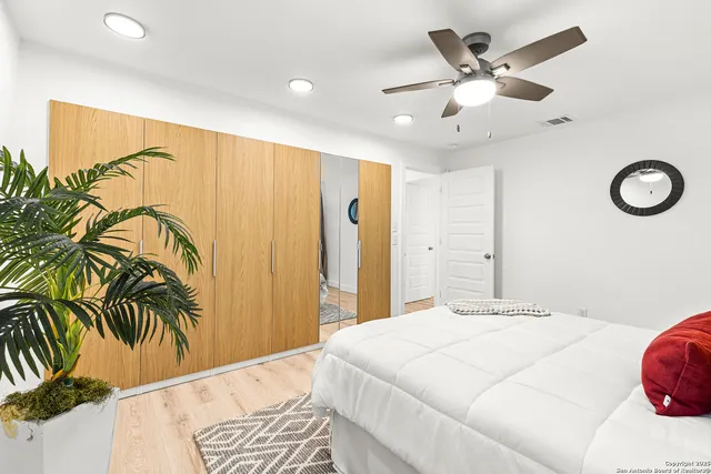 a bathroom with a sink mirror and