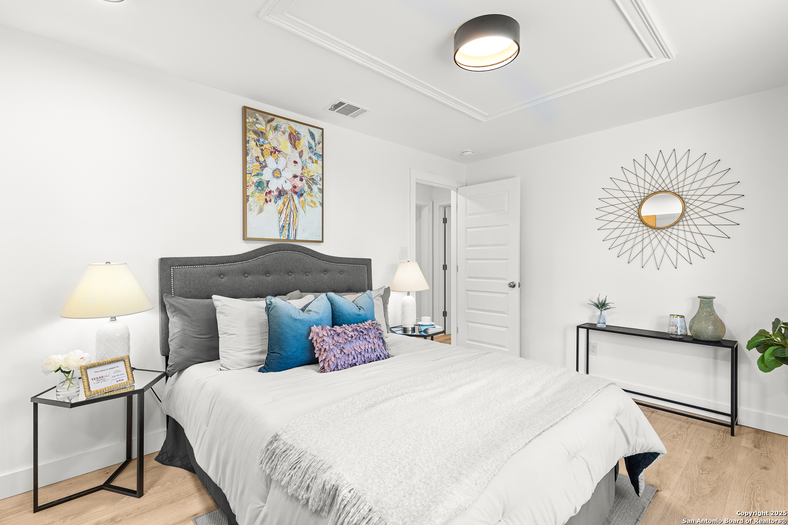 446 Spaceway Drive Windcrest, TX 78239 - Photo 26 of 28 a bedroom with a bed and painting on the wall