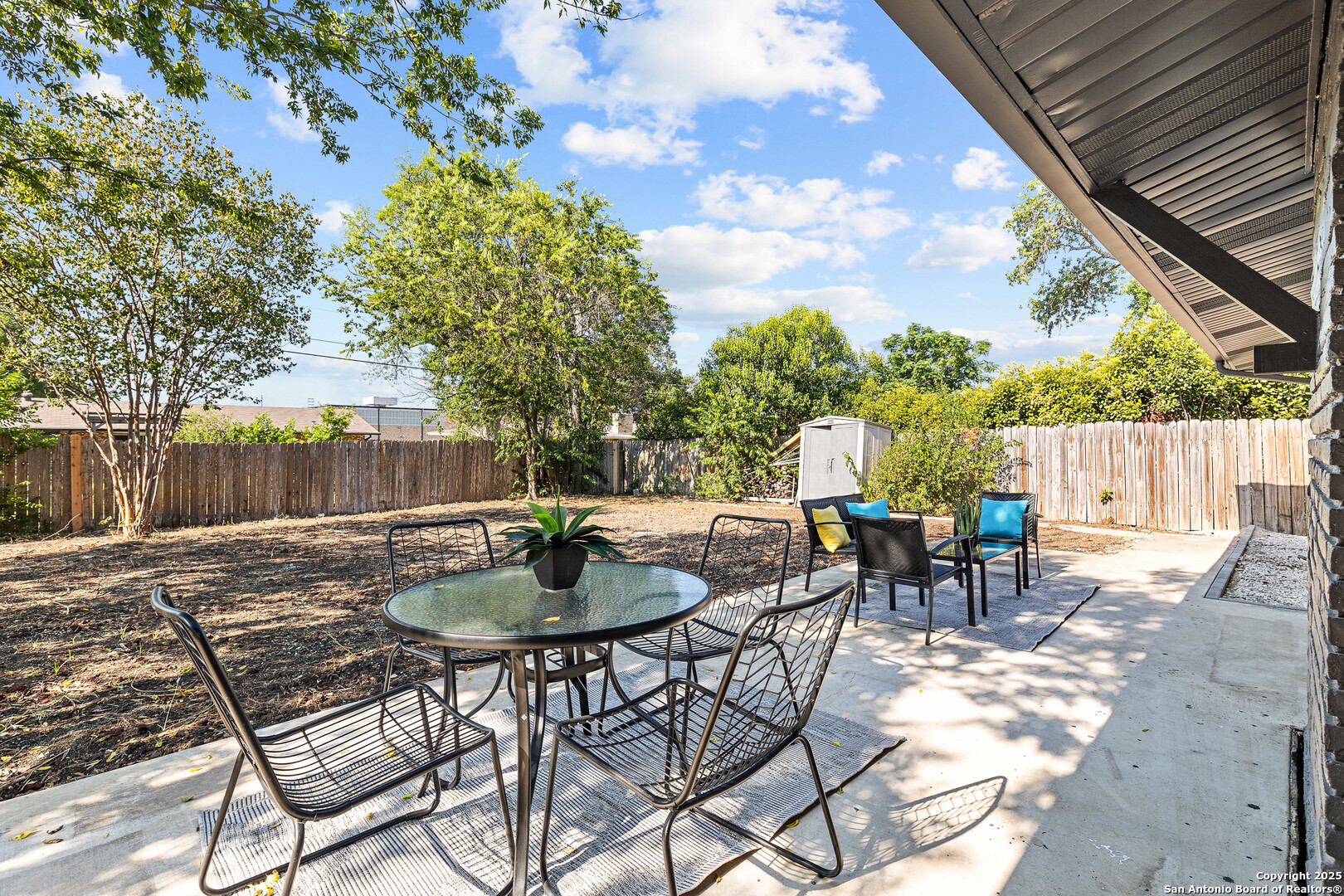 446 Spaceway Drive Windcrest, TX 78239 - Photo 27 of 28 a view of a tables and chairs in the patio