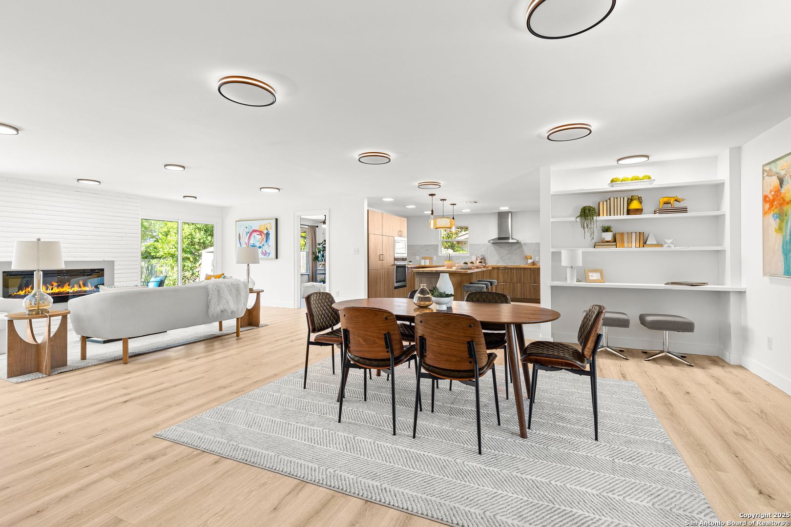446 Spaceway Drive Windcrest, TX 78239 - Photo 8 of 28 a view of a dining room with furniture and wooden floor