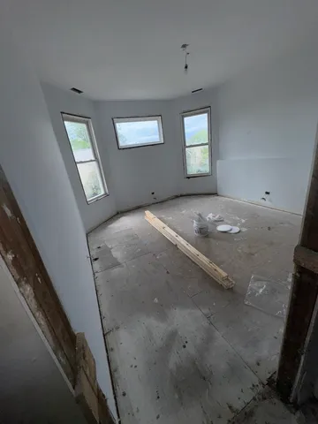 a view of a hallway with windows