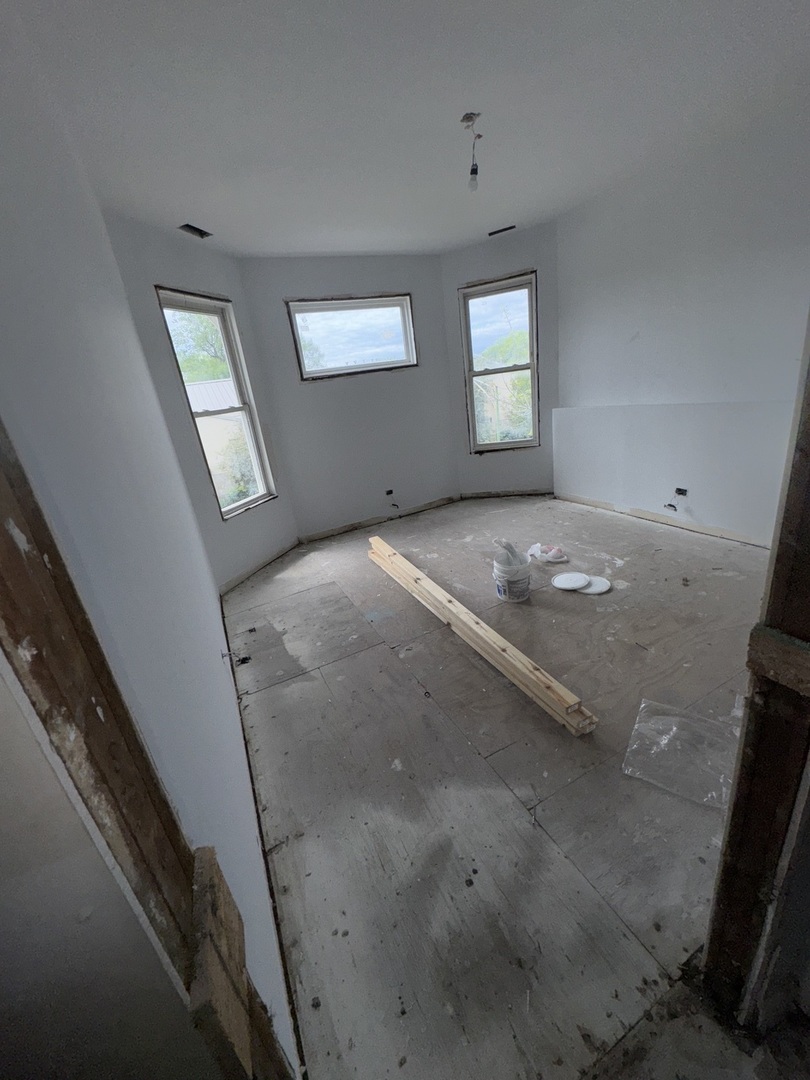 7051 South Princeton Avenue Chicago, IL 60621 - Photo 9 of 19 a view of a hallway with windows