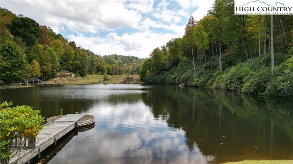 a view of a lake with a yard