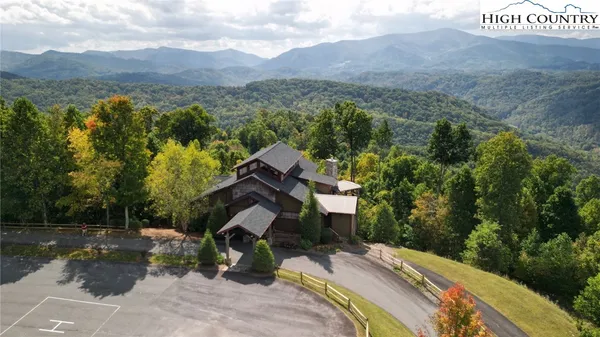a view of a car is parked in front of a building