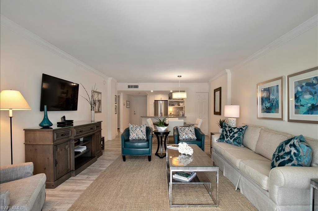 Undisclosed Address Naples, FL 34108 - Photo 5 of 14 a living room with furniture and a flat screen tv