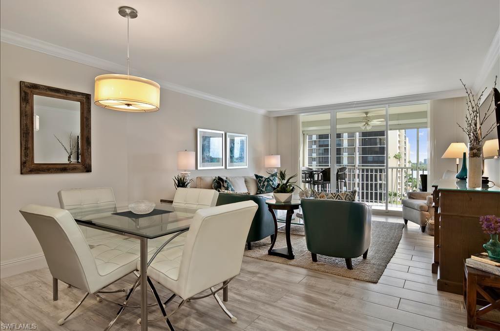 Undisclosed Address Naples, FL 34108 - Photo 7 of 14 a dining room with furniture and wooden floor
