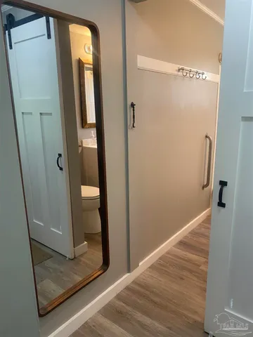 a view of a bathroom from a corridor