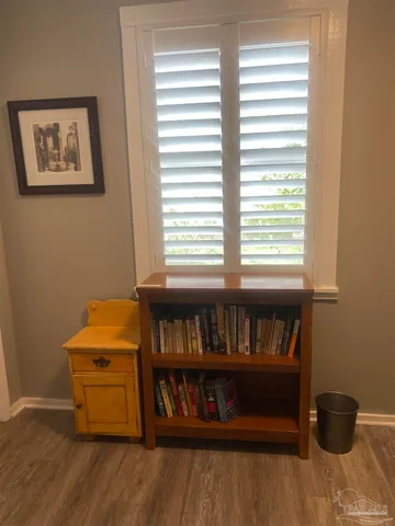 a room with chair and a window