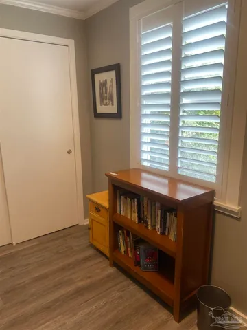 a view of a room with furniture and a window
