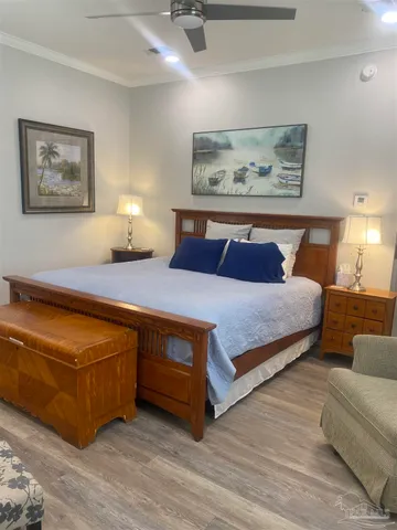 a bedroom with a bed and a couch