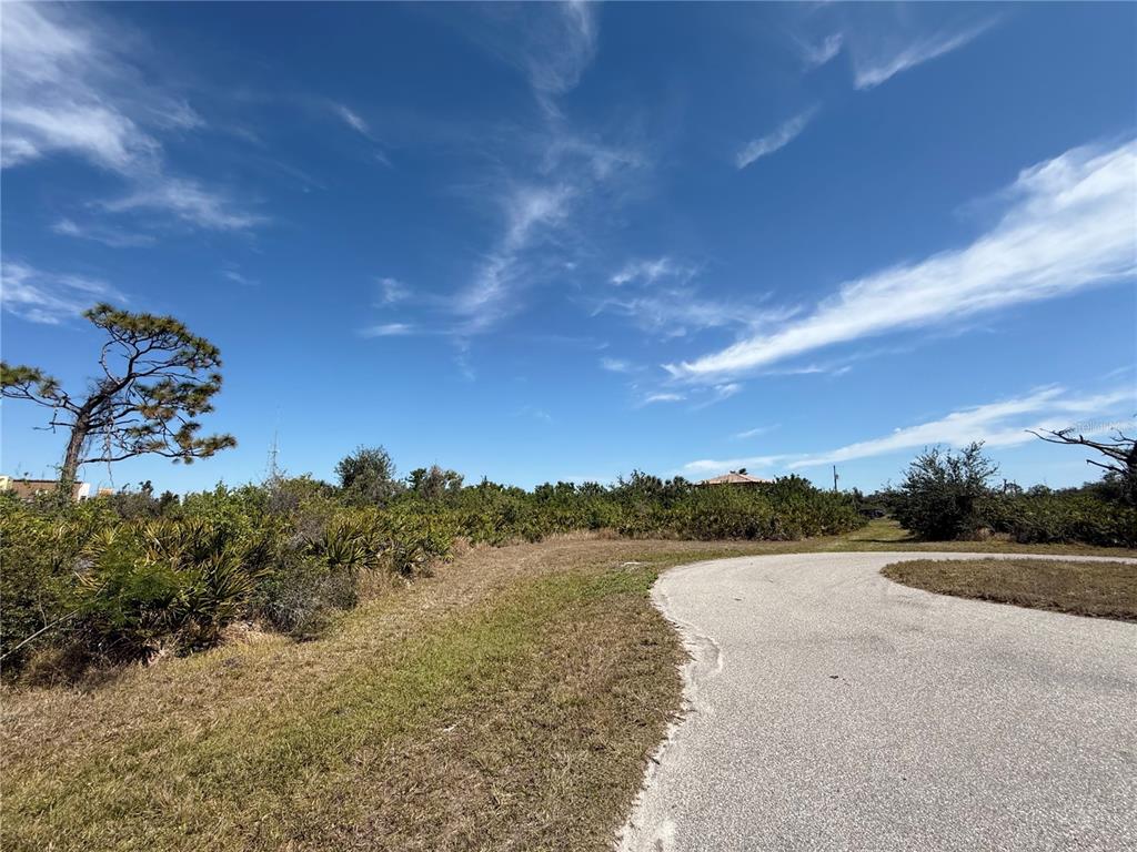 24 Seahawk Court Placida, FL 33946 - Photo 3 of 7 a view of a lake with houses in the back