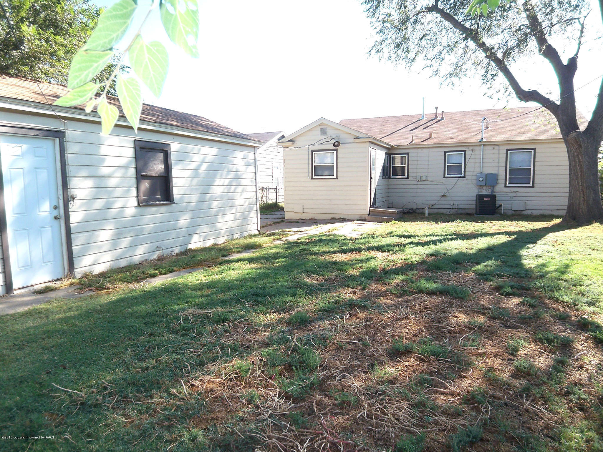 4124 Parker Street Amarillo, TX 79110 - Photo 11 of 12 a front view of a house with a yard