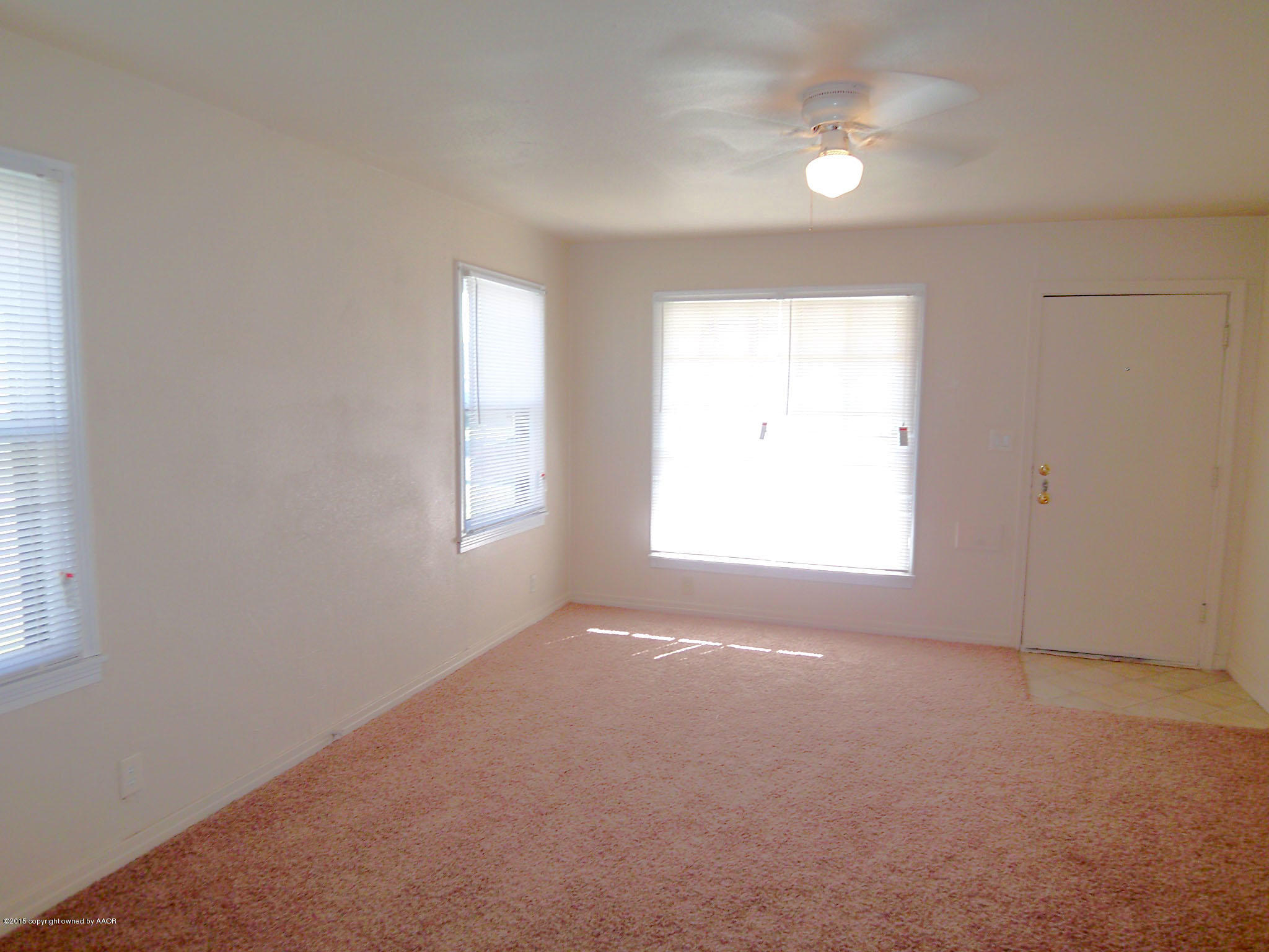 4124 Parker Street Amarillo, TX 79110 - Photo 2 of 12 an empty room with a window