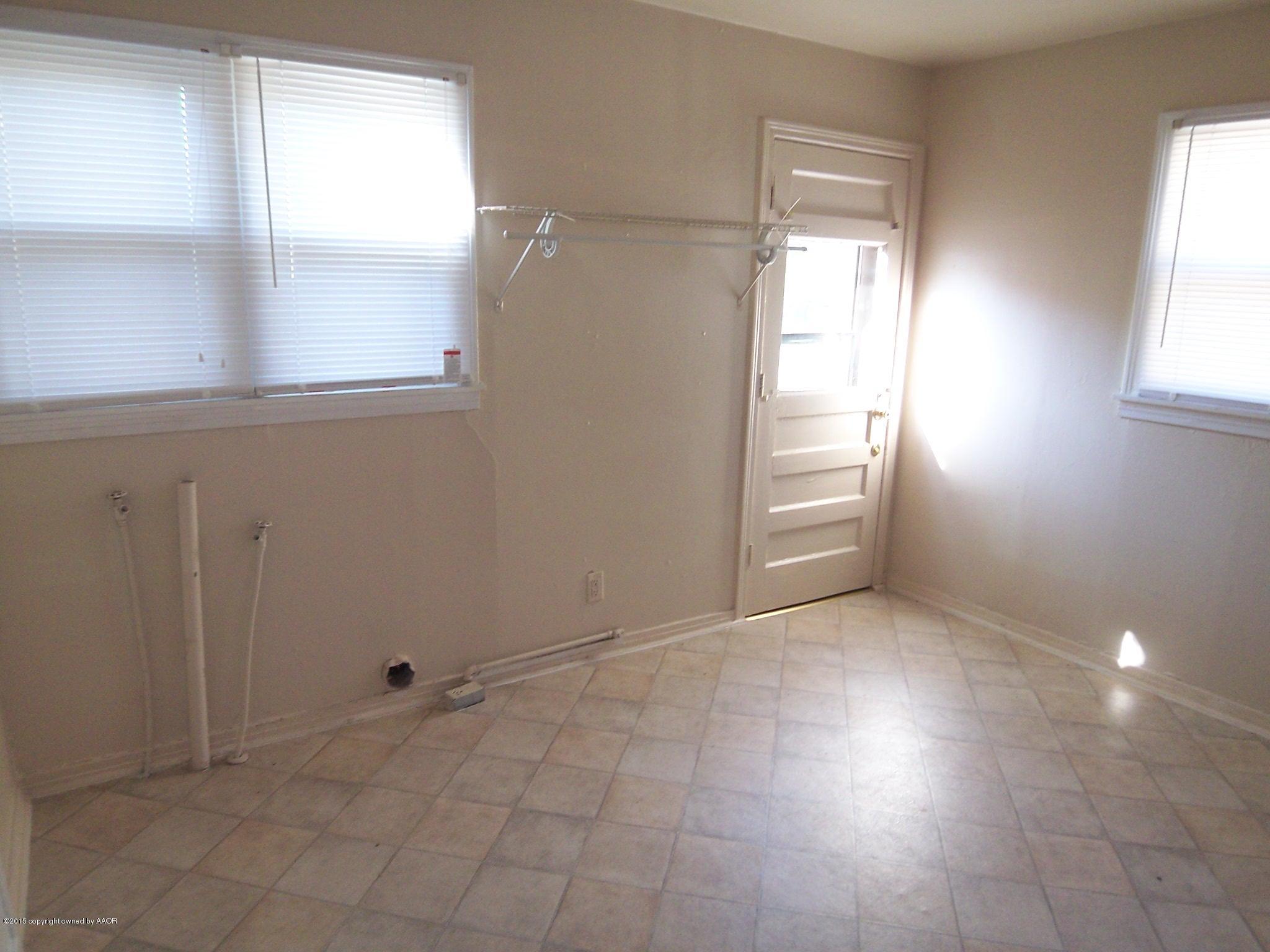 4124 Parker Street Amarillo, TX 79110 - Photo 8 of 12 a view of an empty room with a window