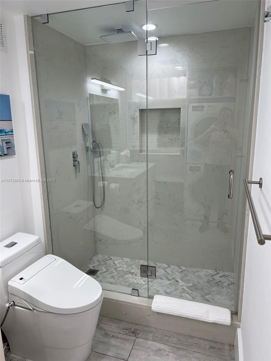 2301 Collins Avenue, Unit 321 Miami Beach, FL 33139 - Photo 19 of 33 a bathroom with a toilet and a shower