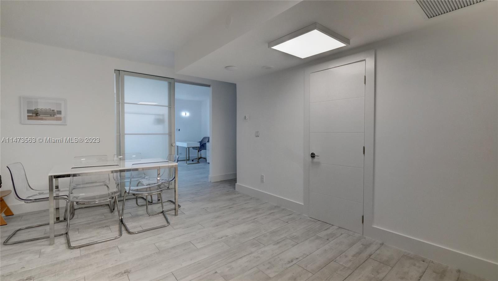 2301 Collins Avenue, Unit 321 Miami Beach, FL 33139 - Photo 7 of 33 a view of a room with furniture and wooden floor