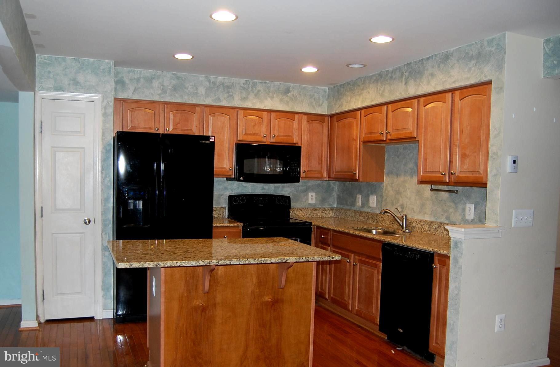 1236 Steed Street Ranson, WV 25438 - Photo 7 of 24 Open Kitchen with island & granite counters