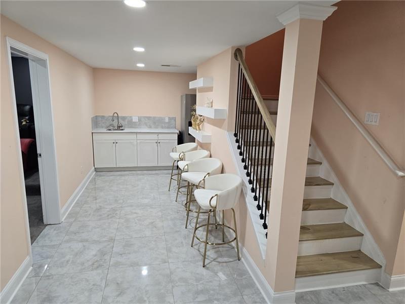 6850 Rocking Horse Lane Cumming, GA 30040 - Photo 26 of 36 a room with white cabinets and white appliances