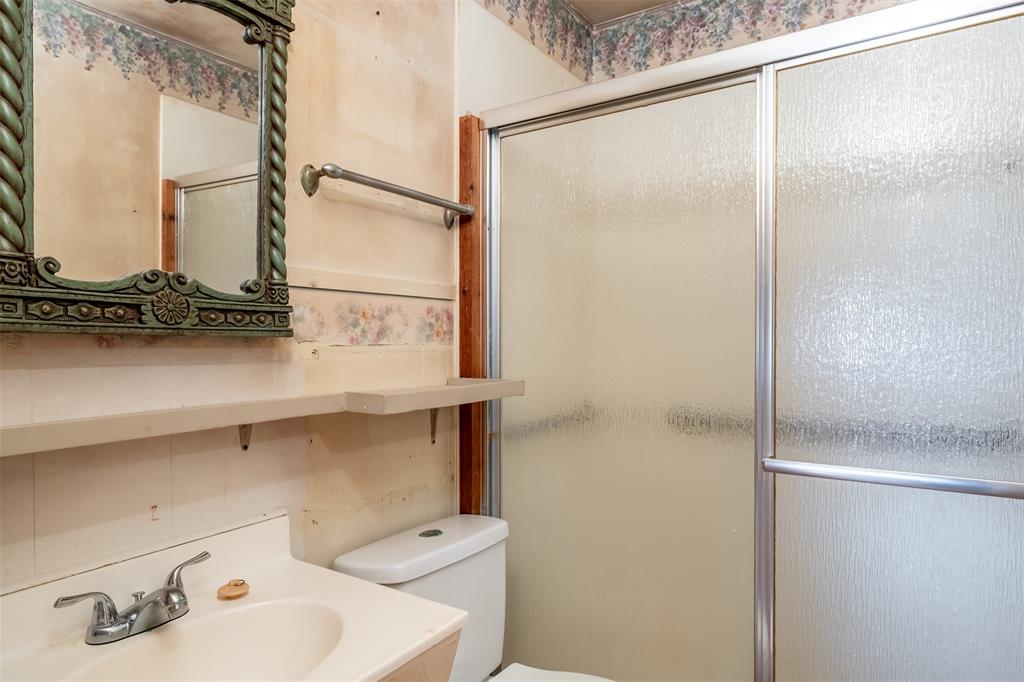 3710 County Road 334 Tyler, TX 75708 - Photo 14 of 29 a bathroom with a sink and a mirror