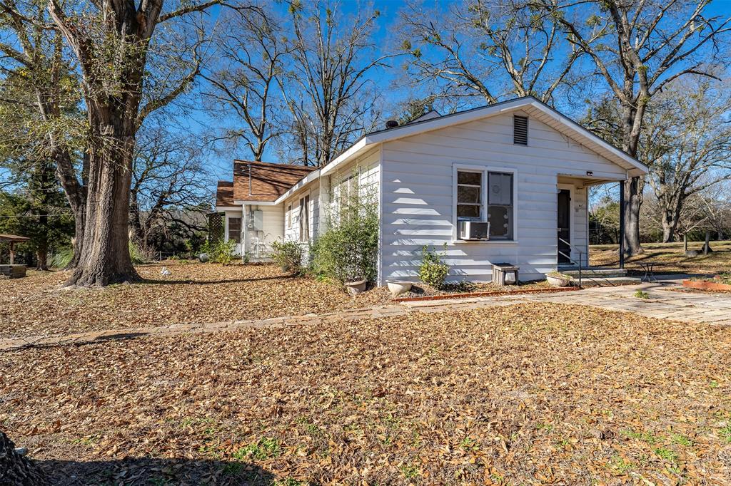 3710 County Road 334 Tyler, TX 75708 - Photo 21 of 29 a house with trees in the background