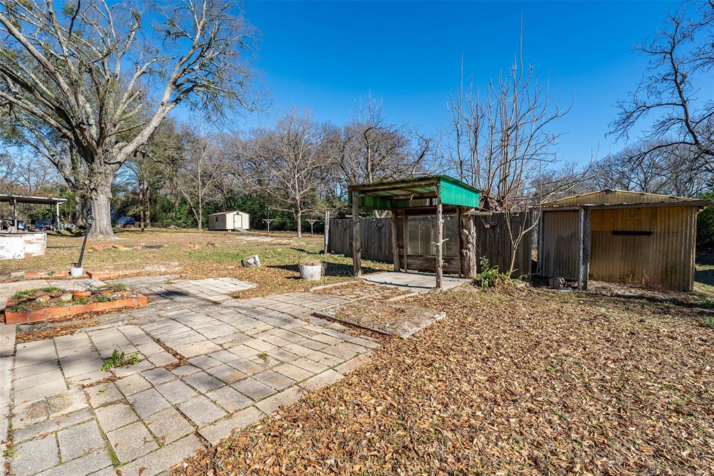 3710 County Road 334 Tyler, TX 75708 - Photo 22 of 29 a backyard of a house with barbeque oven and outdoor seating