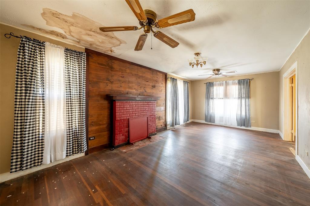 3710 County Road 334 Tyler, TX 75708 - Photo 5 of 29 an empty room with wooden floor and windows