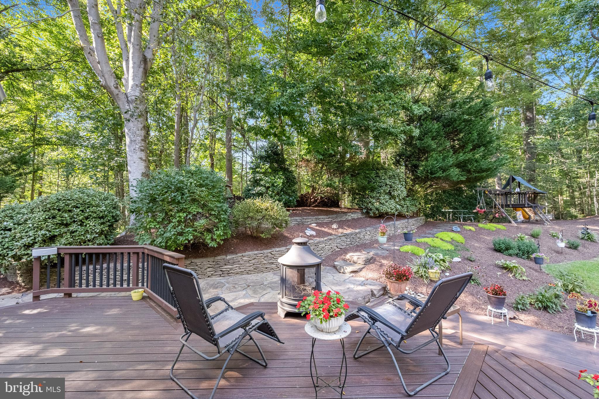 6601 Colchester Road Fairfax Station, VA 22039 - Photo 34 of 78 a view of backyard with seating and trees