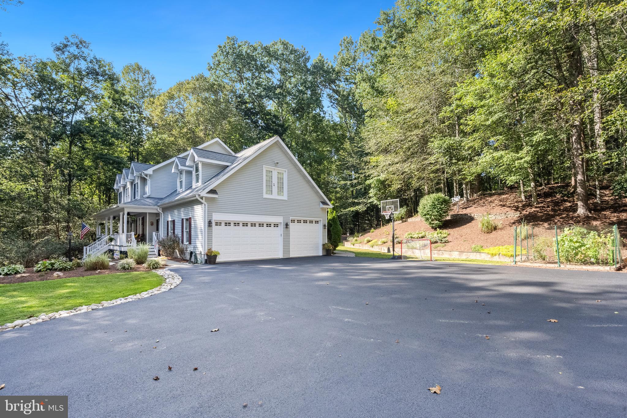 6601 Colchester Road Fairfax Station, VA 22039 - Photo 4 of 78 a view of a house with a yard and large tree